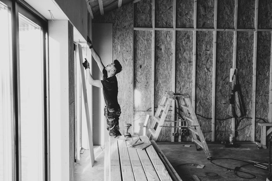 Professional contractor installing a new window frame
